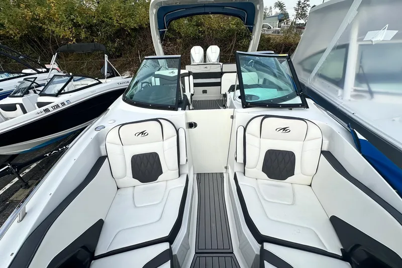 Slide: The Image of 2019 Monterey 305SS Super Sport boat with sleek white seating and modern design. - 43