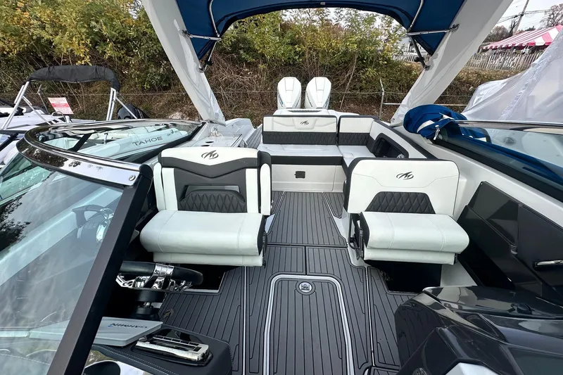 Slide: The Image of 2019 Monterey 305SS Super Sport boat interior with white seating and speakers. - 44