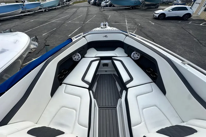 Slide: The Image of 2019 Monterey 305SS Super Sport boat at a dealership with other boats and cars. - 47