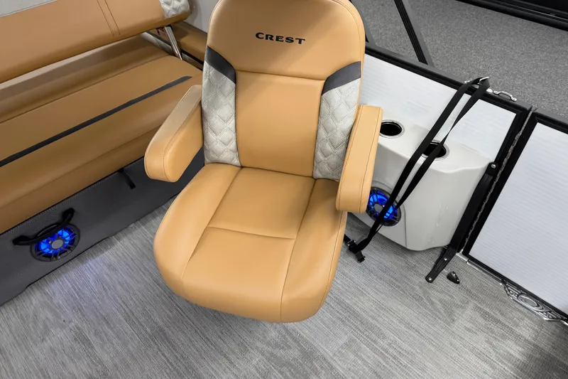 Slide: The Image of Luxurious seating in 2025 Crest Classic 220 boat with modern design and blue LED lighting. - 8