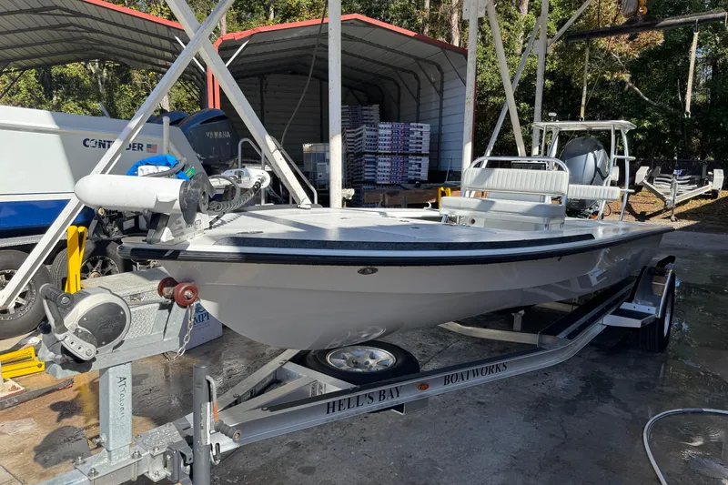 Slide: The Image of 2020 Hell's Bay Marquesa boat on trailer in outdoor storage area. - 0