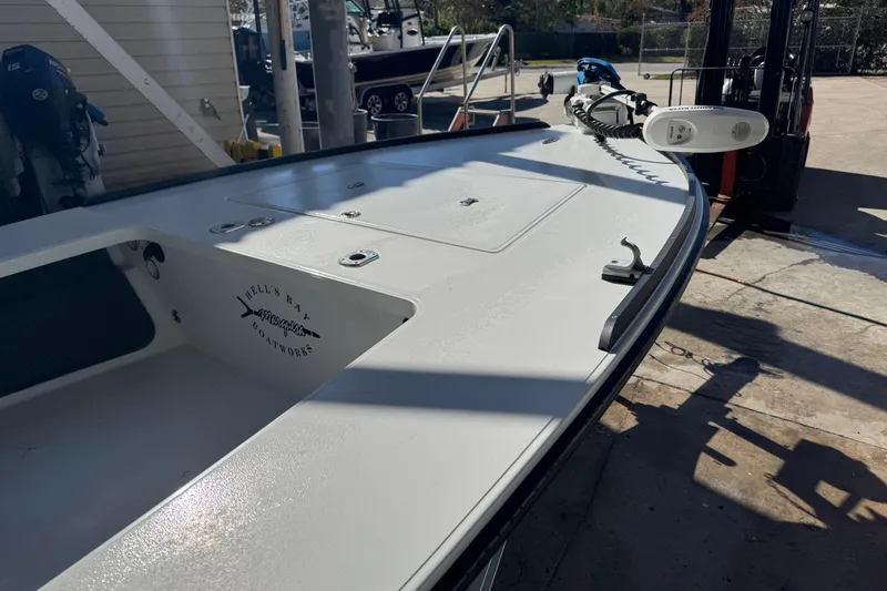 Slide: The Image of 2020 Hell's Bay Marquesa boat on a dock, showcasing sleek design and craftsmanship. - 4