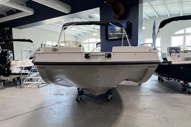 Slide: The Image of 2025 Starcraft SVX 171 OB boat displayed in a showroom, showcasing its sleek design. - 3