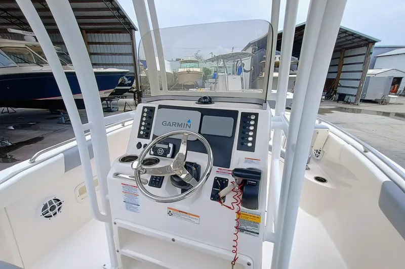 Slide: The Image of 2023 Robalo R222 Center Console boat dashboard with Garmin navigation system. - 11