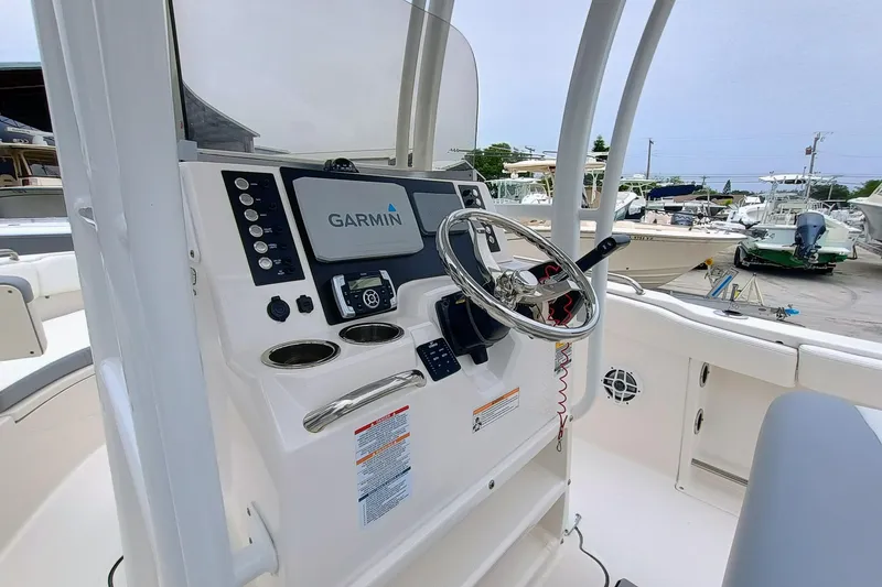 Slide: The Image of 2023 Robalo R222 Center Console boat dashboard with Garmin navigation system. - 16
