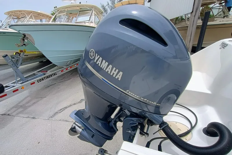 Slide: The Image of 2023 Robalo R222 Center Console with Yamaha outboard motor on trailer. - 26