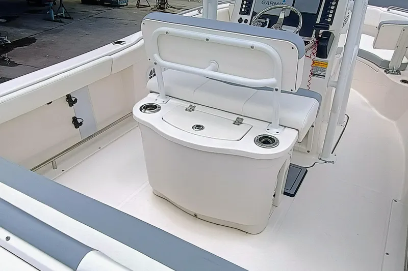 Slide: The Image of 2023 Robalo R222 Center Console boat interior with seating and console. - 7