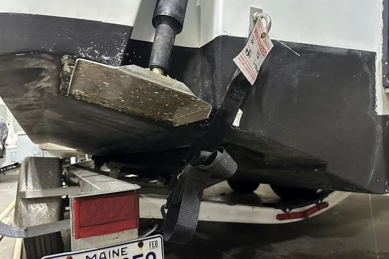 Slide: The Image of 2018 Robalo R242 Explorer boat interior with cushioned seating and cup holders. - 14