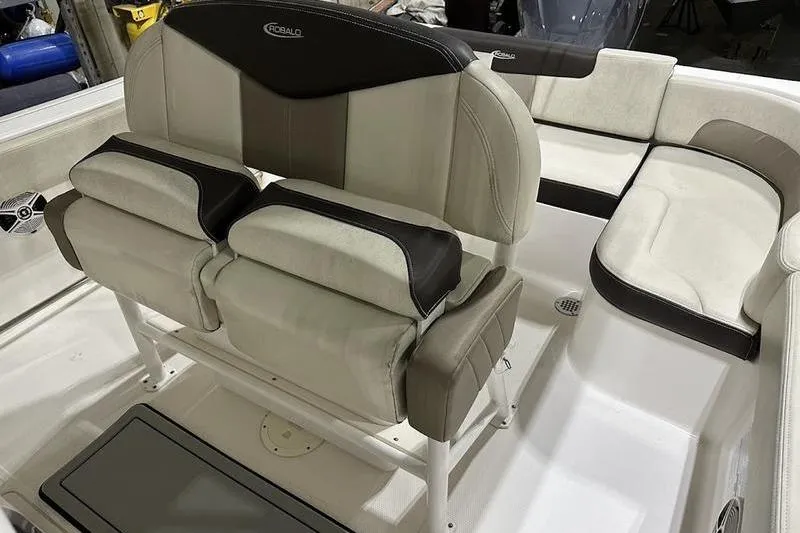 Slide: The Image of 2018 Robalo R242 Explorer boat interior with seating and control panel. - 19