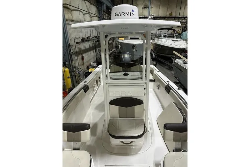 Slide: The Image of 2018 Robalo R242 Explorer boat interior with compact marine toilet. - 28