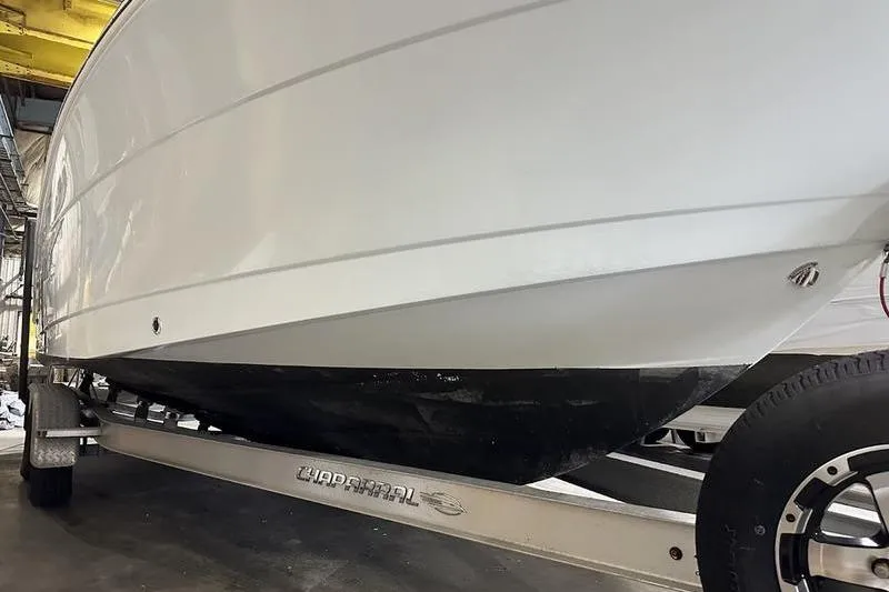 Slide: The Image of 2018 Robalo R242 Explorer boat with Yamaha engine in a storage facility. - 5