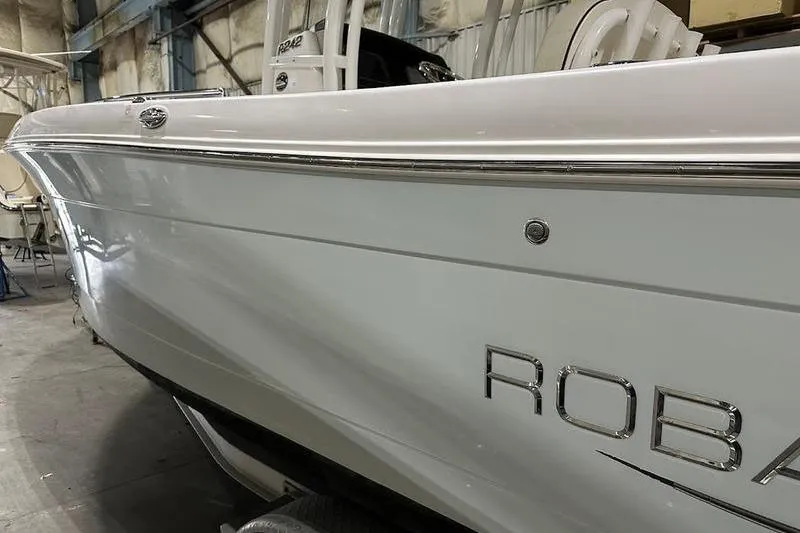 Slide: The Image of Trailer wheel of 2018 Robalo R242 Explorer boat on a metal frame. - 8