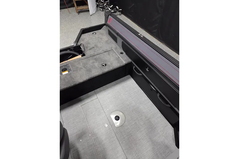 Slide: The Image of 2025 Alumacraft Trophy 185X Sport interior, featuring spacious deck and storage compartments. - 11