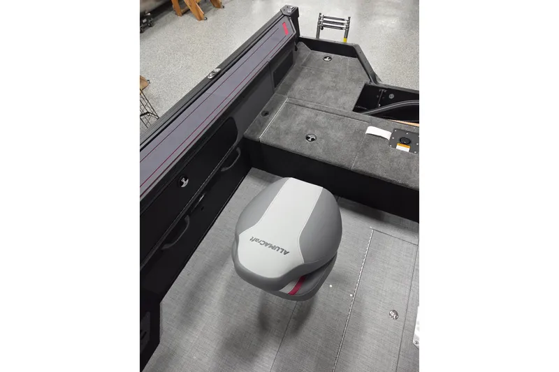 Slide: The Image of 2025 Alumacraft Trophy 185X Sport boat interior with seating and storage compartments. - 12
