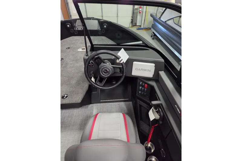 Slide: The Image of 2025 Alumacraft Trophy 185X Sport boat cockpit with Garmin navigation system. - 8