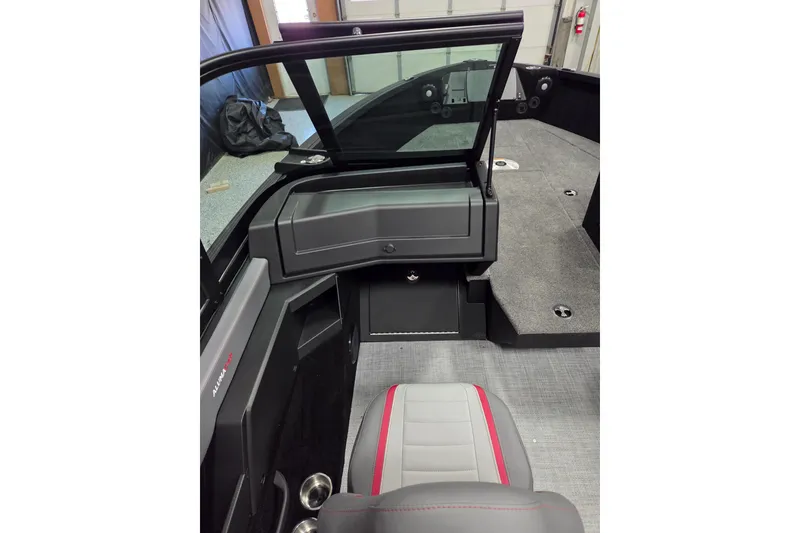 Slide: The Image of 2025 Alumacraft Trophy 185X Sport boat interior with seating and dashboard view. - 9