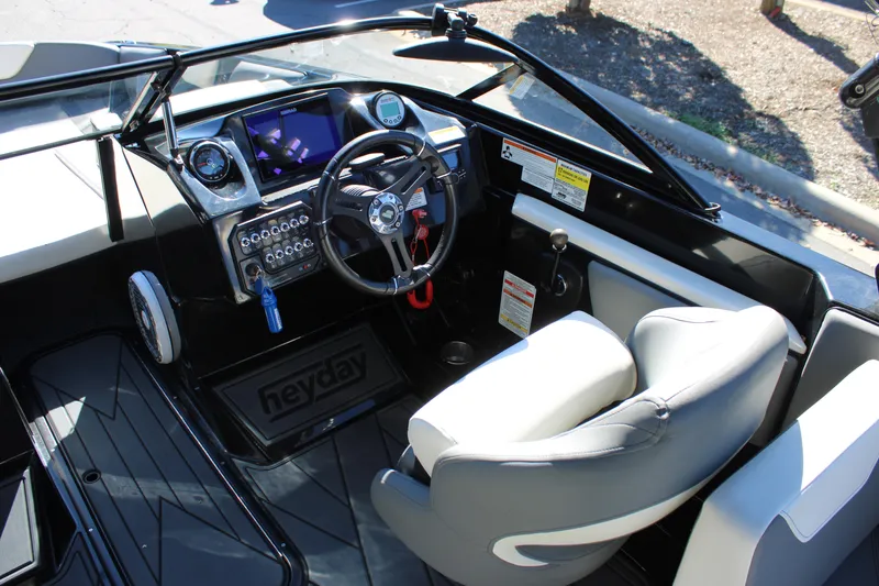 Slide: The Image of 2019 Heyday WTSurf boat cockpit with steering wheel and control panel. - 17