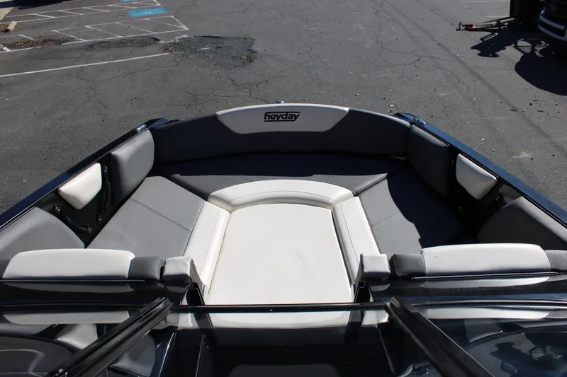 Slide: The Image of 2019 Heyday WTSurf boat interior with gray and white seating. - 19