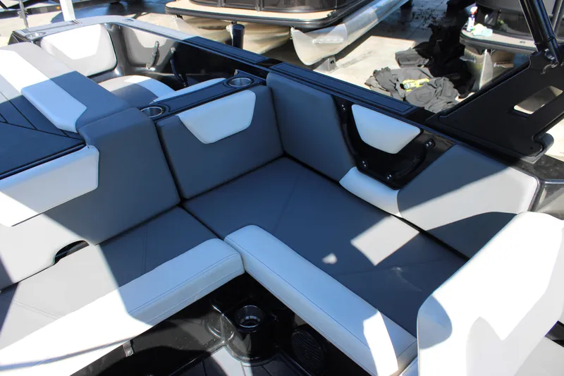 Slide: The Image of 2019 Heyday WTSurf boat interior with gray and white seating arrangement. - 24