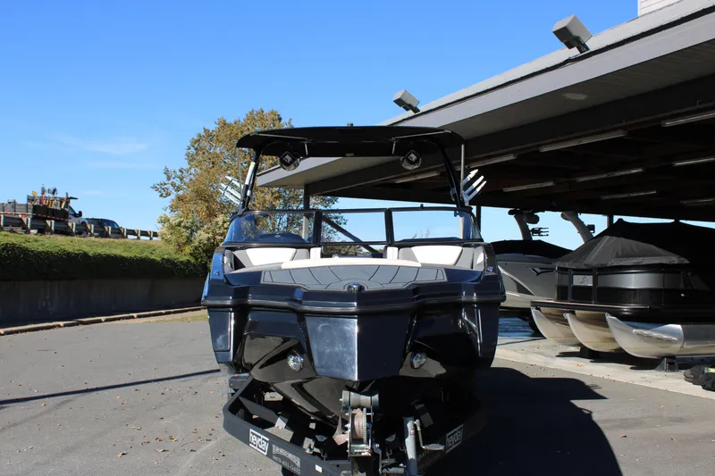Slide: The Image of 2019 Heyday WTSurf boat parked under a shelter on a sunny day. - 3