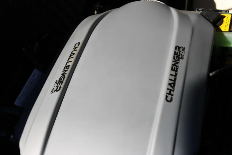 Slide: The Image of Engine cover of a 2019 Heyday WTSurf boat, labeled "Challenger WT-60." - 34