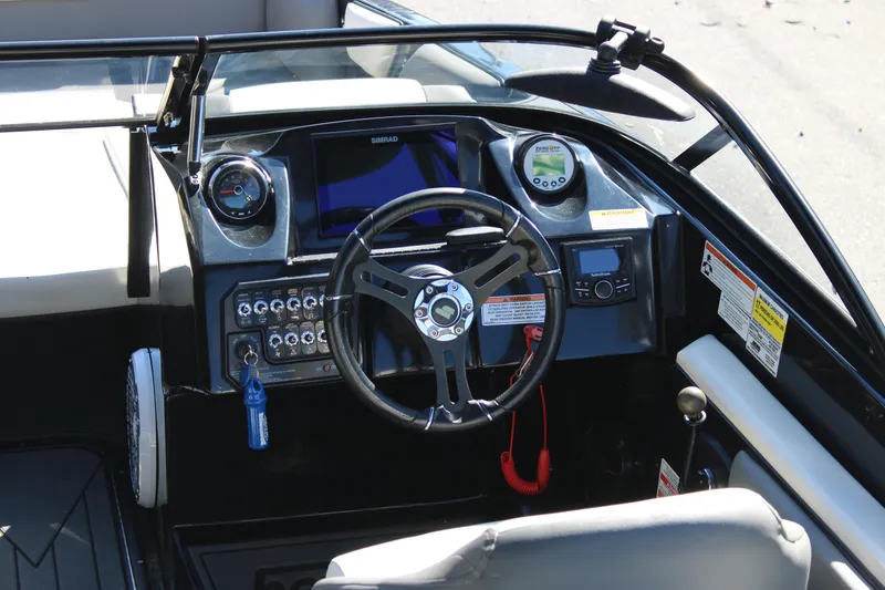 Slide: The Image of 2019 Heyday WTSurf boat dashboard with steering wheel and control panel. - 16