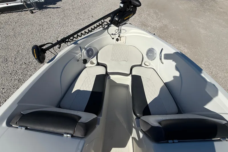 Slide: The Image of 2016 Tahoe 550TF boat interior with seating and trolling motor. - 10
