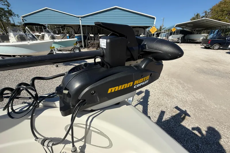 Slide: The Image of Minn Kota Copilot trolling motor on 2016 Tahoe 550TF boat, parked in marina. - 13