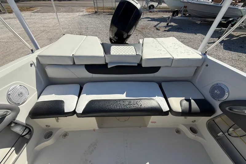 Slide: The Image of 2016 Tahoe 550TF boat interior with cushioned seating and speakers. - 6