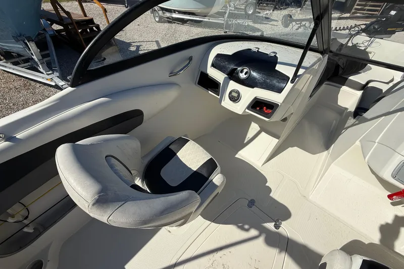 Slide: The Image of Interior of a 2016 Tahoe 550TF boat, featuring a sleek dashboard and comfortable seating. - 9