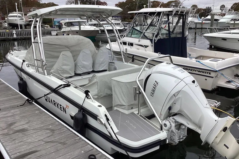 Slide: The Image of 2024 Quarken 27 T-Top V2 boat docked, featuring Yamaha outboard engine. - 1