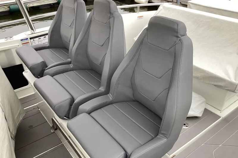 Slide: The Image of Three sleek gray seats on 2024 Quarken 27 T-Top V2 boat. - 10