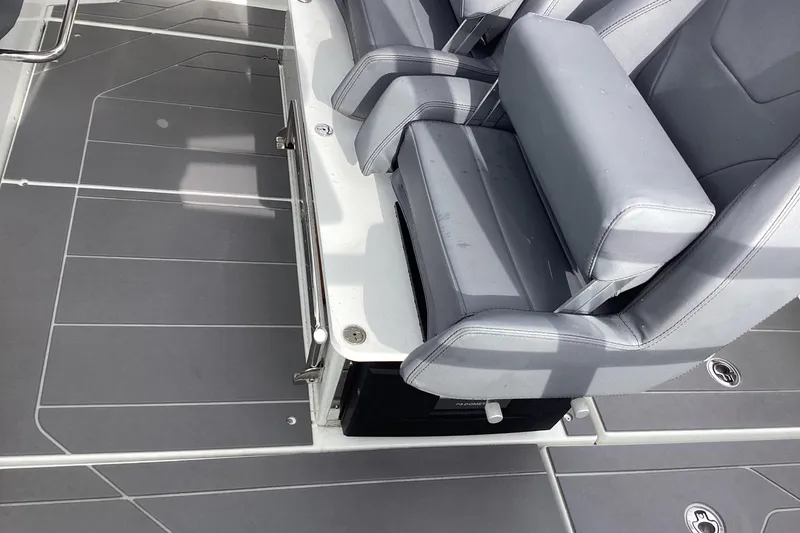 Slide: The Image of 2024 Quarken 27 T-Top V2 boat interior with sleek gray seating and modern flooring. - 27