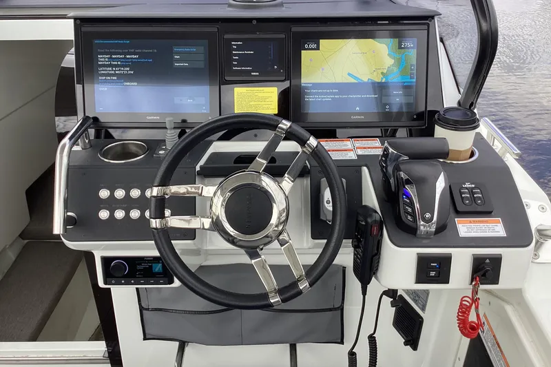 Slide: The Image of Cockpit of 2024 Quarken 27 T-Top V2 with advanced navigation displays. - 28