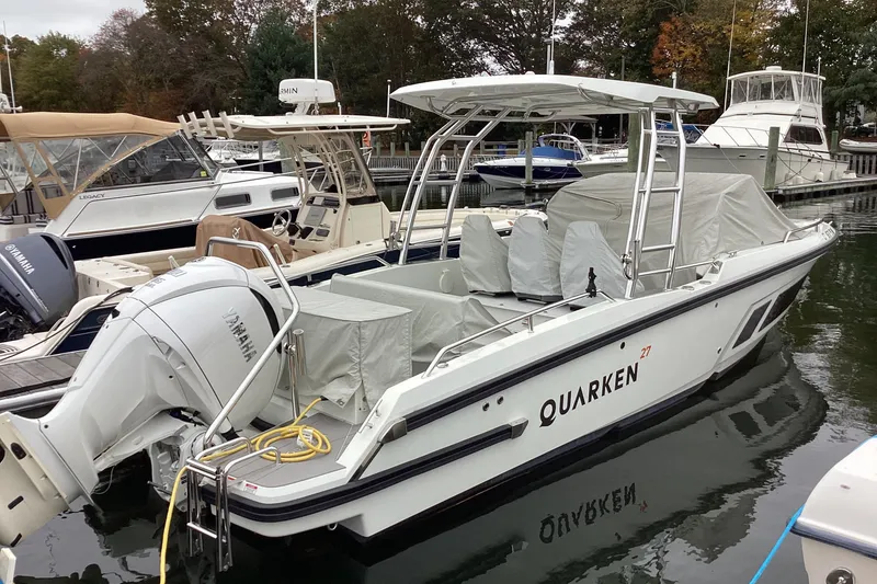 Slide: The Image of 2024 Quarken 27 T-Top V2 boat docked, featuring Yamaha outboard engine. - 3