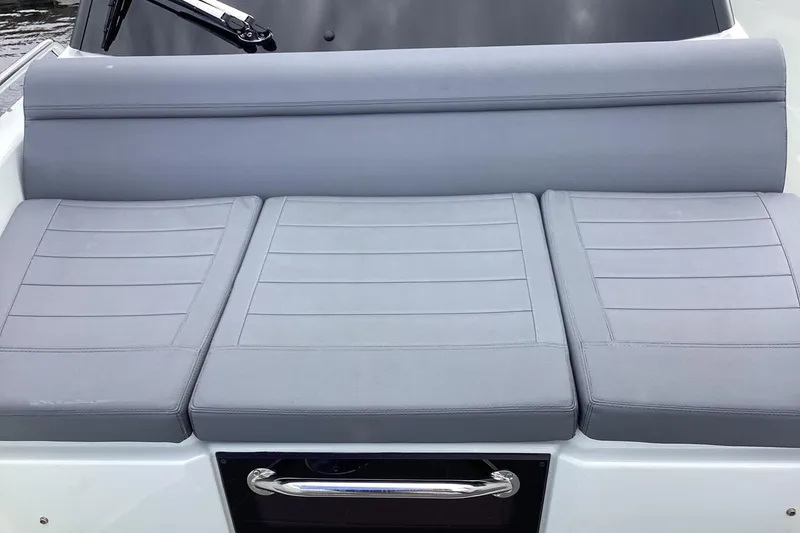 Slide: The Image of 2024 Quarken 27 T-Top V2 boat with sleek gray seating and modern design. - 33