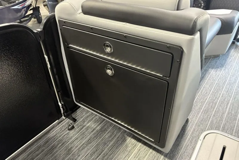 Slide: The Image of 2026 Premier 230 Sunsation RL interior with sleek black storage compartment. - 10