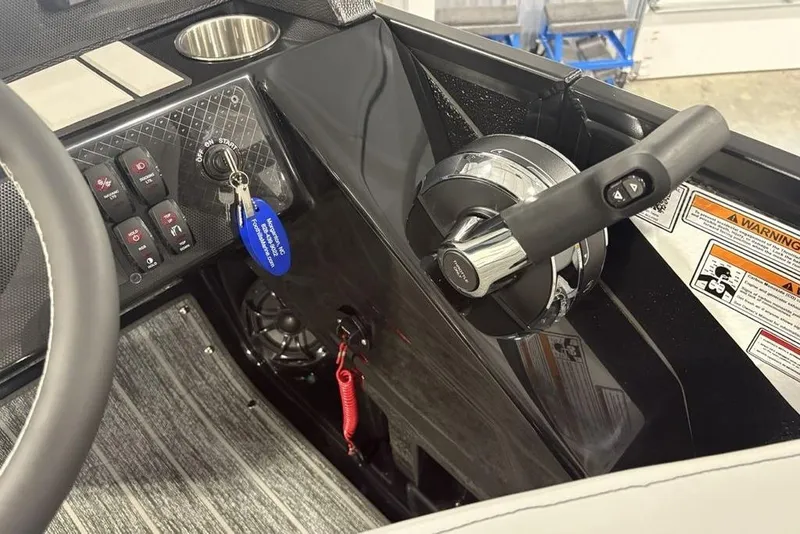 Slide: The Image of Control panel of 2026 Premier 230 Sunsation RL boat with steering wheel and throttle. - 20