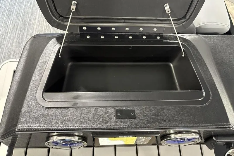 Slide: The Image of Open storage compartment on 2026 Premier 230 Sunsation RL boat. - 22