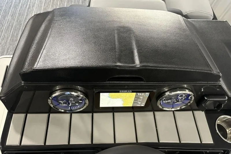 Slide: The Image of Dashboard of 2026 Premier 230 Sunsation RL boat with navigation display and gauges. - 24