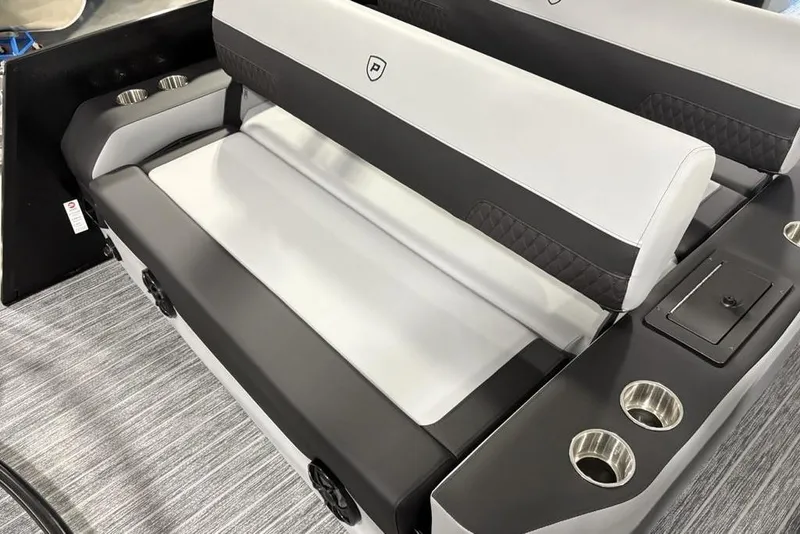 Slide: The Image of 2026 Premier 230 Sunsation RL boat seating with cup holders and sleek design. - 31
