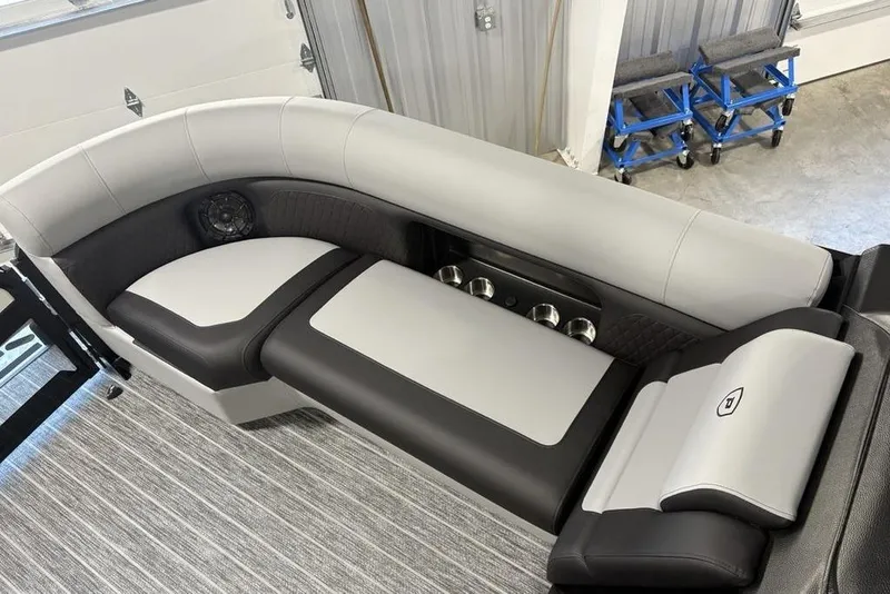 Slide: The Image of Luxurious seating on 2026 Premier 230 Sunsation RL pontoon boat, featuring sleek design and cup holders. - 4