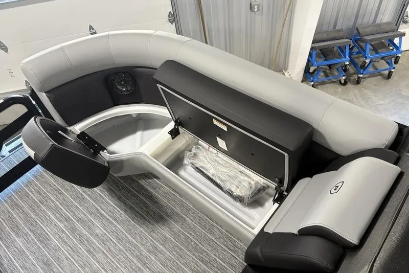 Slide: The Image of 2026 Premier 230 Sunsation RL boat interior with storage compartment and seating. - 5