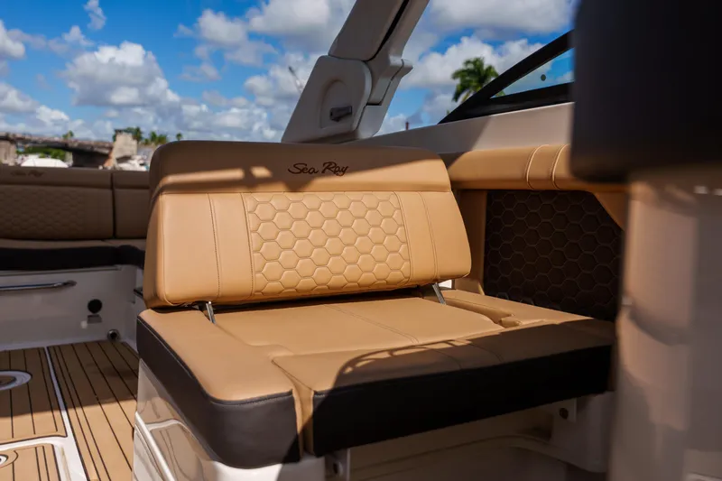Slide: The Image of Luxurious Sea Ray boat interior with tan leather seating and honeycomb pattern. - 10