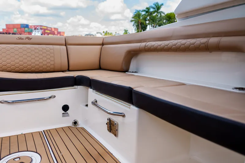 Slide: The Image of Luxurious Sea Ray boat interior with tan seating and sleek design. - 14