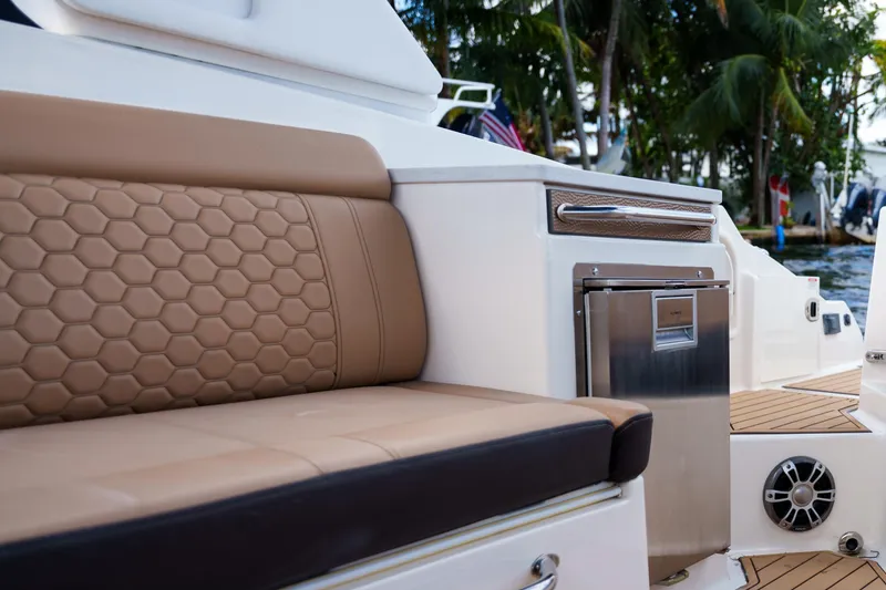 Slide: The Image of Luxurious Sea Ray boat interior with tan seating and stainless steel accents. - 15