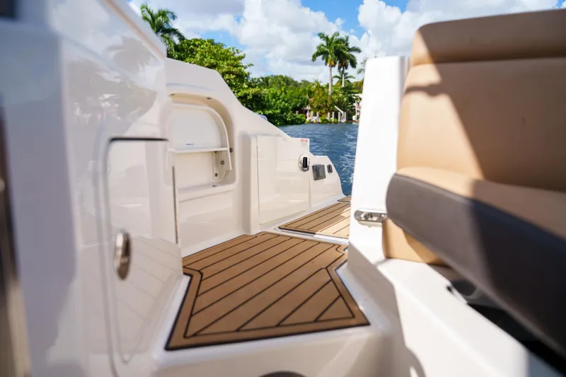 Slide: The Image of Luxurious Sea Ray boat deck with tan seating and scenic water view. - 19