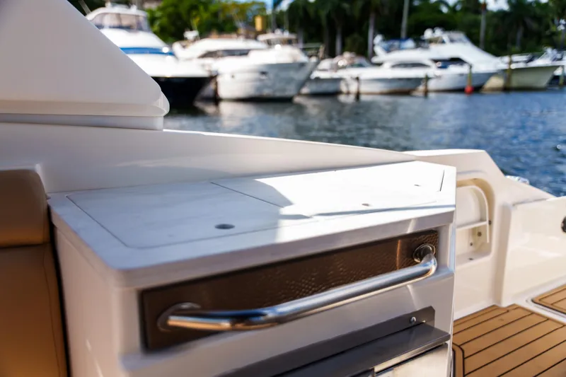 Slide: The Image of Luxury Sea Ray boat interior with sleek design, docked near other yachts. - 25