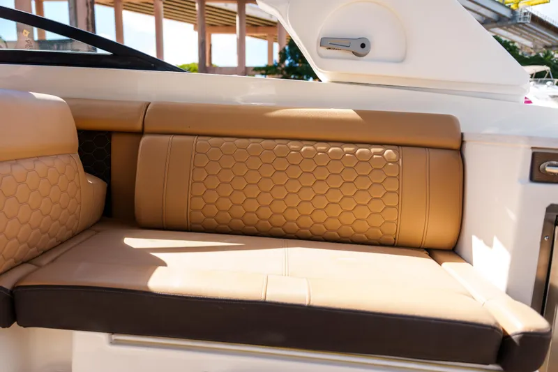 Slide: The Image of Luxurious tan seating on a Sea Ray boat with hexagonal pattern design. - 26