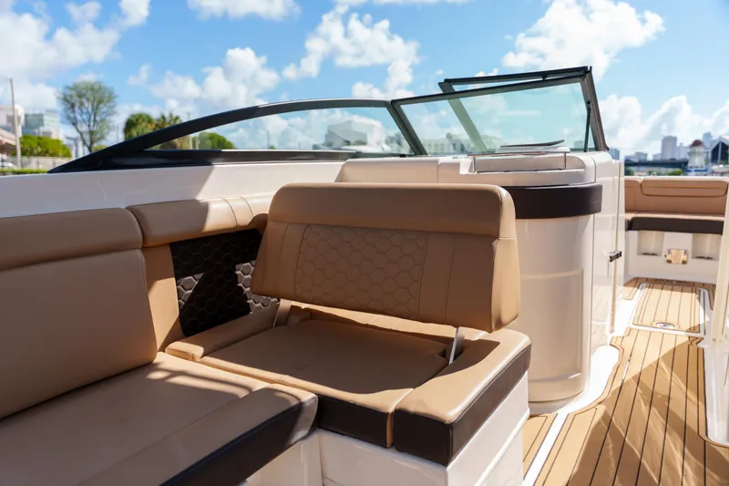 Slide: The Image of Luxurious Sea Ray boat interior with tan leather seating and sleek design. - 28